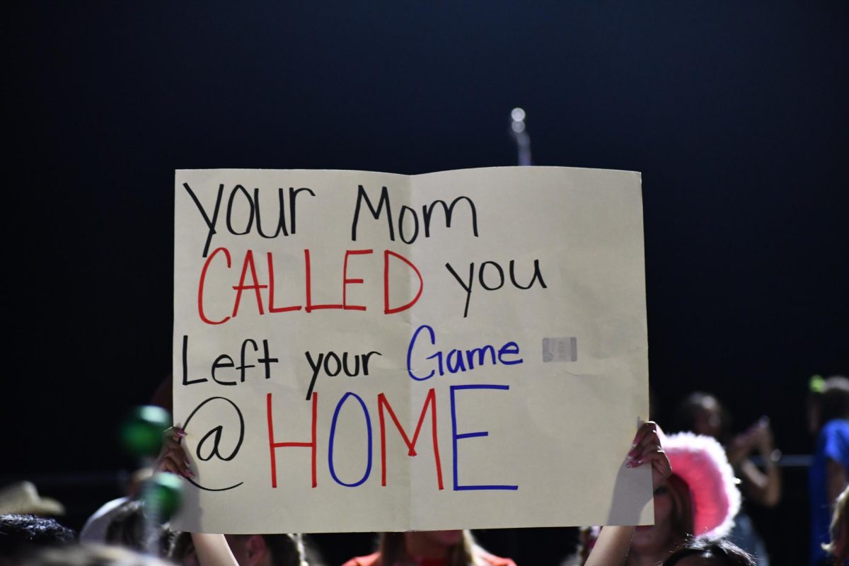 Student section poster. "Your mom called. You left your game @ home."