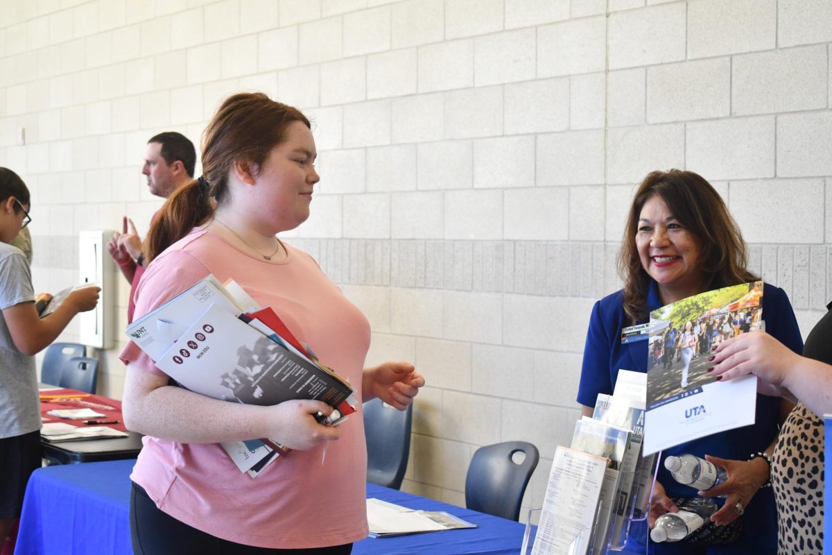 Student smiling with college advisor