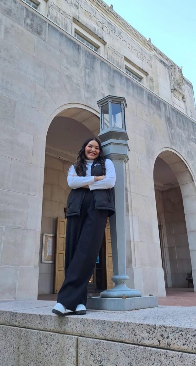 Ms. Gutierrez outside Graham Memorial Auditorium