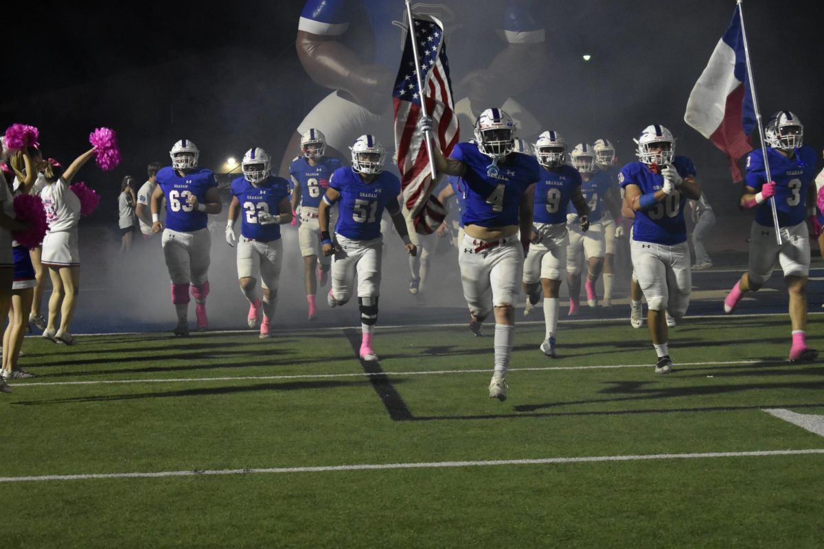 Players run down the field. 