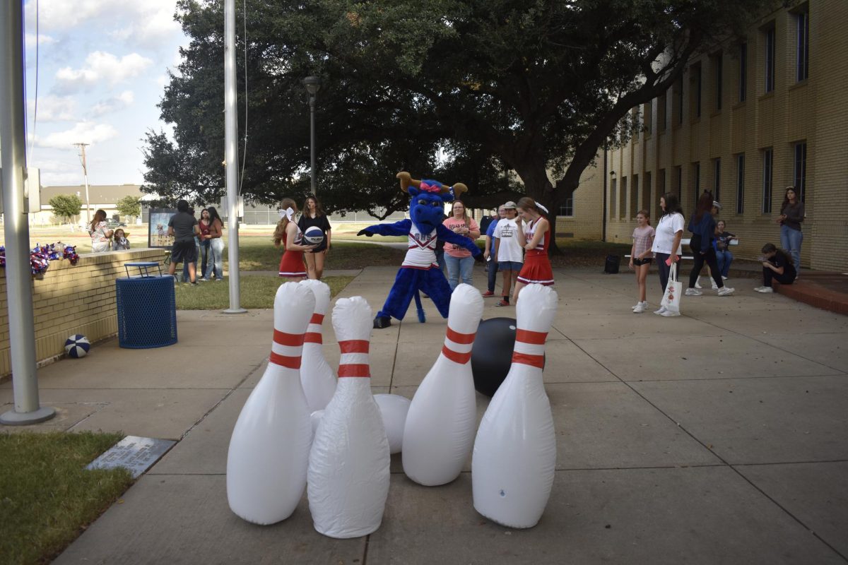 'Ol Blue knocks down bowling pins. 