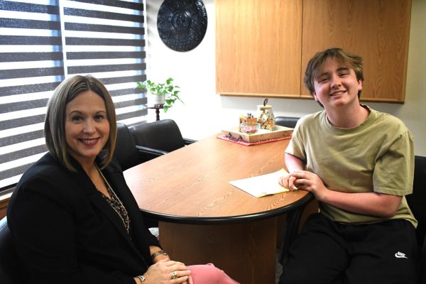 Dr. Mary Johnston and Cy Sweedler pose for a photo after their interview.
