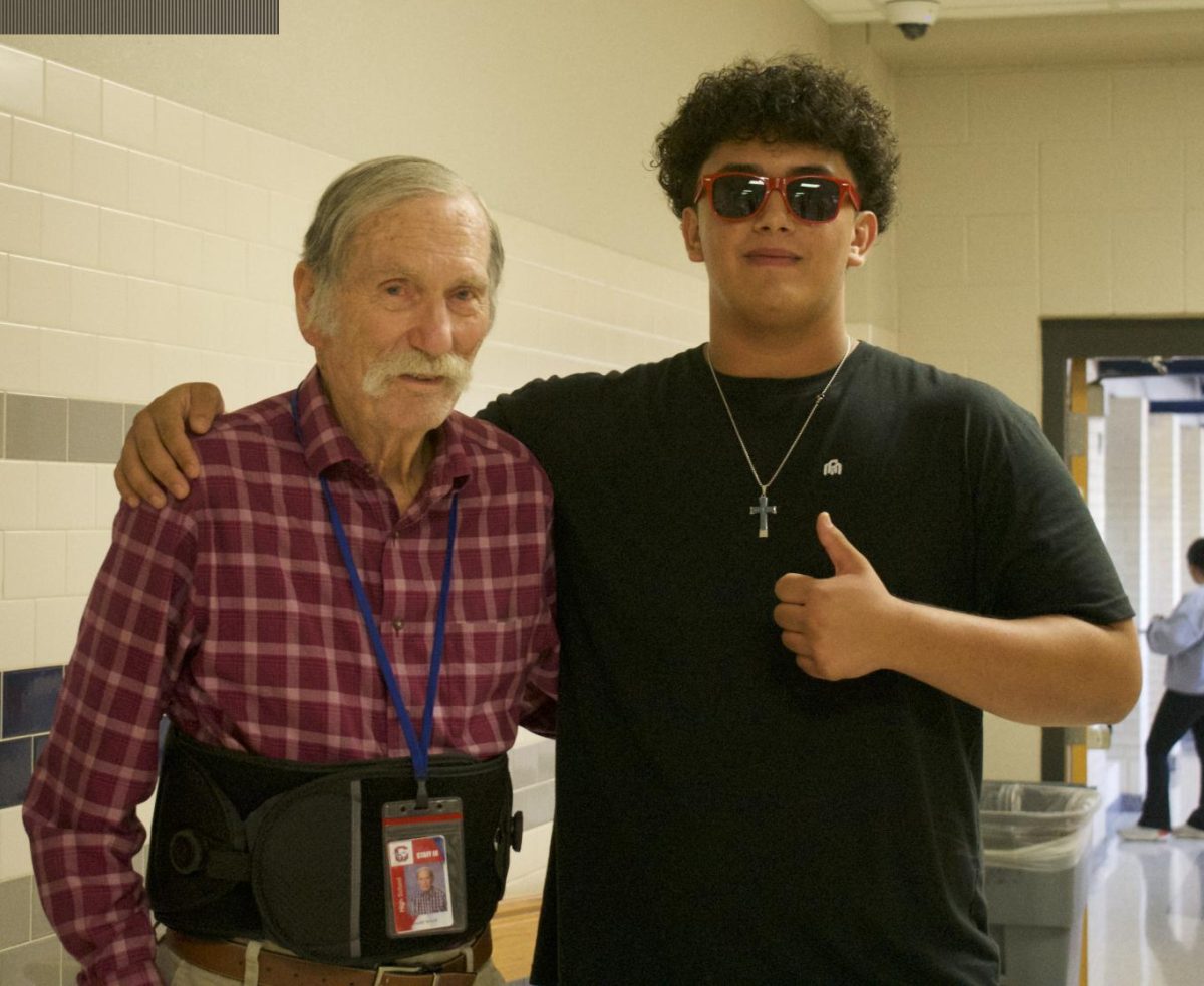 Don Sewell and Matthew Monrreal pose in the hallway for a photo
